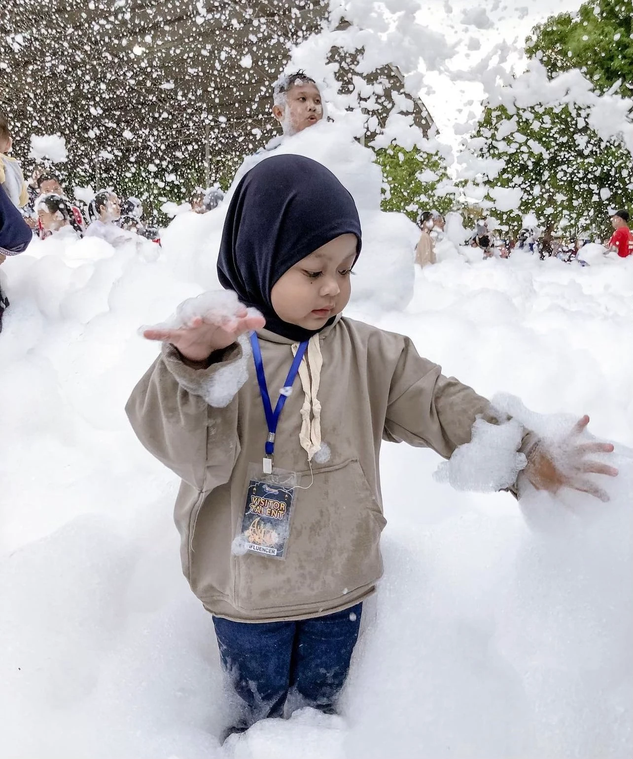 Foam party kids playing in foam